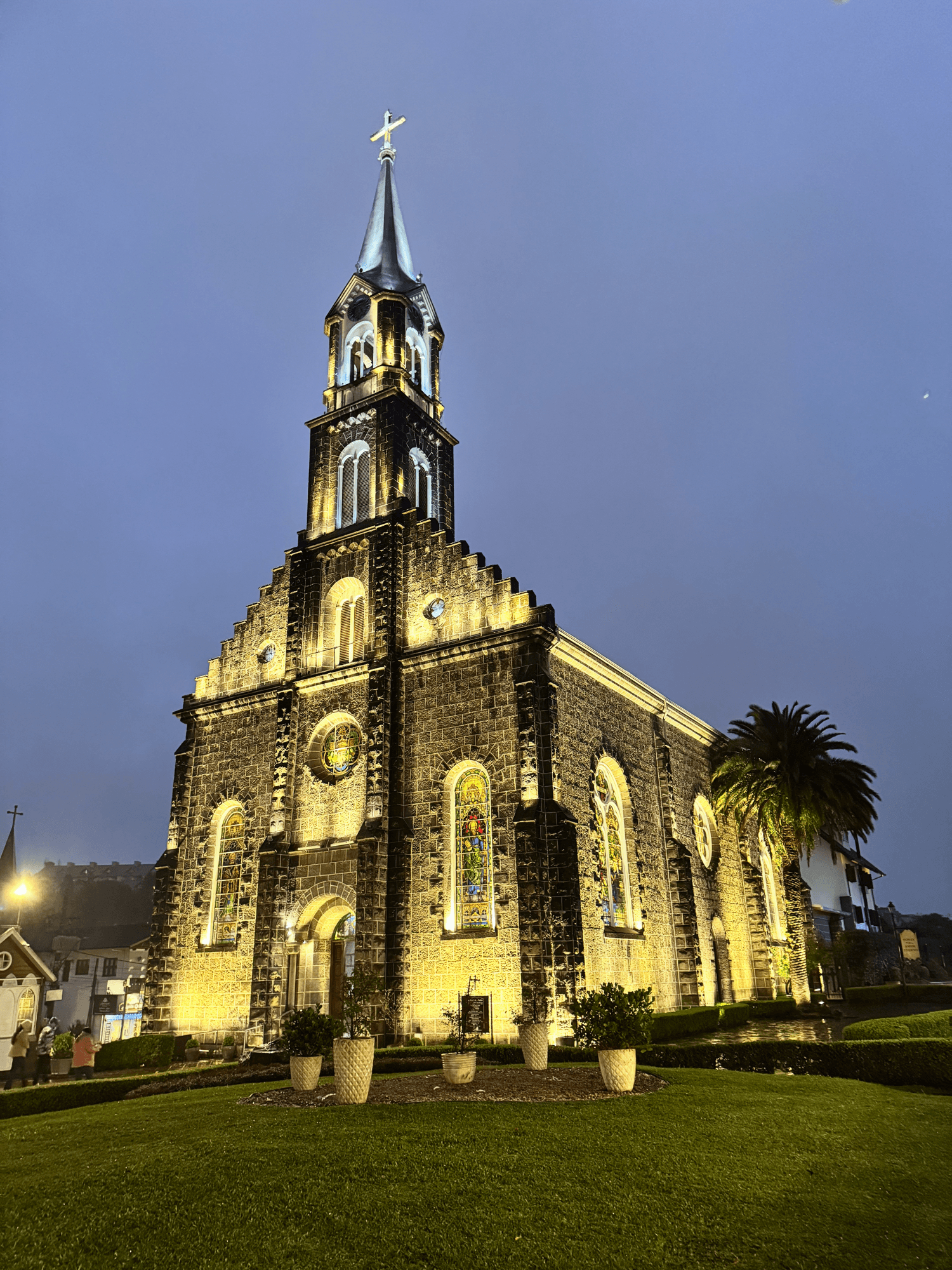 Beautiful stone cathedral with really nice lighting. Cloudy skies in the background